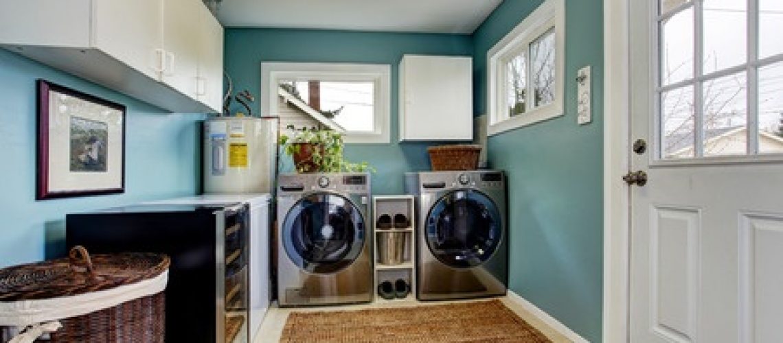 30283015 - light blue laundry room with modern steel appliances and white cabinets